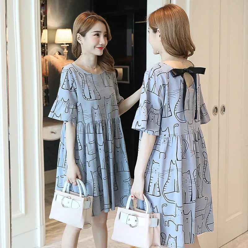 Loose Korean cartoon cat maternity dress in blue, featuring a boat neck and short sleeves, ideal for summer wear.