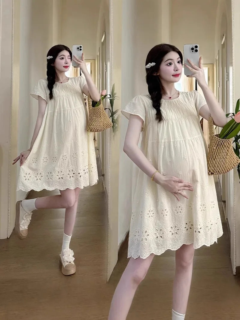 A-line cotton maternity dress in natural color, featuring boat neck and knee-length design, perfect for summer wear.