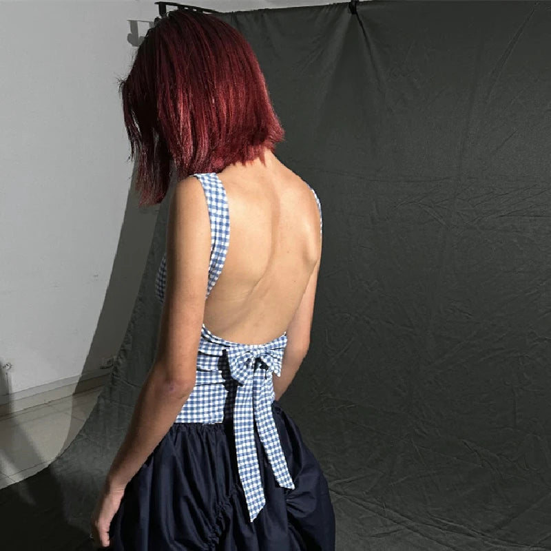 Back view of a woman wearing a plaid bow backless crop top, showcasing the stylish Y2K streetwear design.