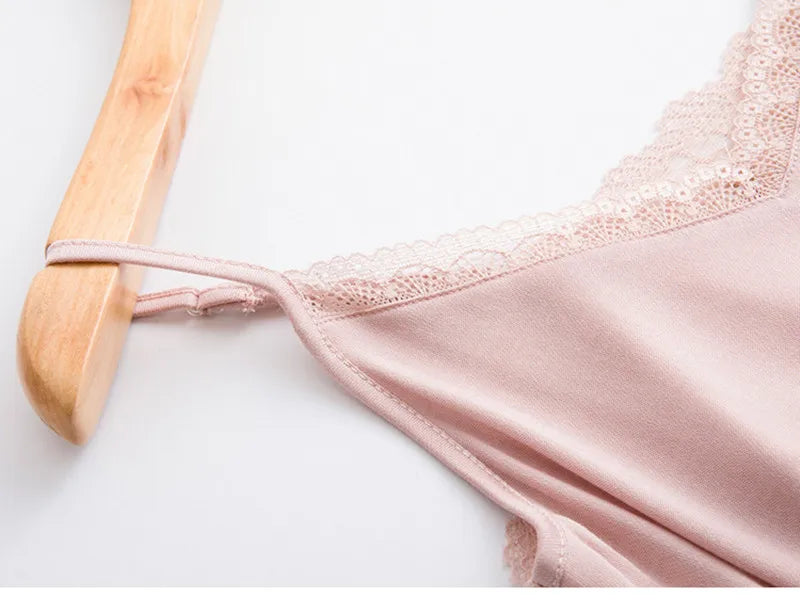 LuxeLace™ silk camisole tank top in blush with lace trim on wooden hanger.