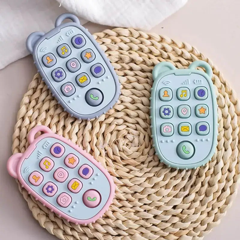 Colorful silicone toy phones for kids in blue, green, and pink, designed for playful learning and sensory engagement.