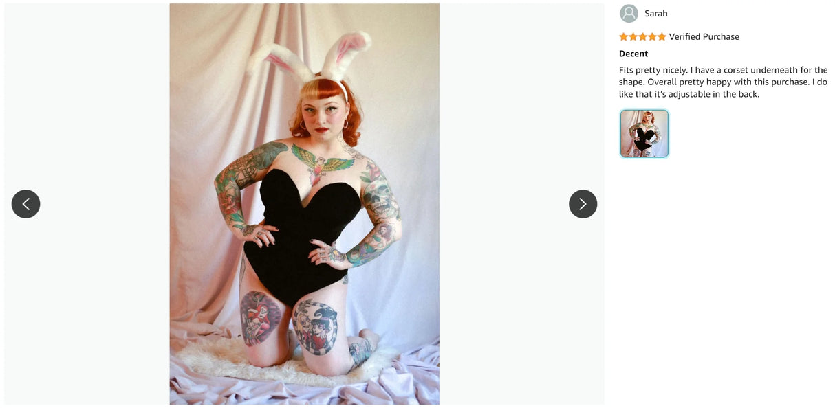 Model wearing a strapless black bodysuit with tattoos, featuring a playful bunny ear headband, showcasing stylish nightwear.