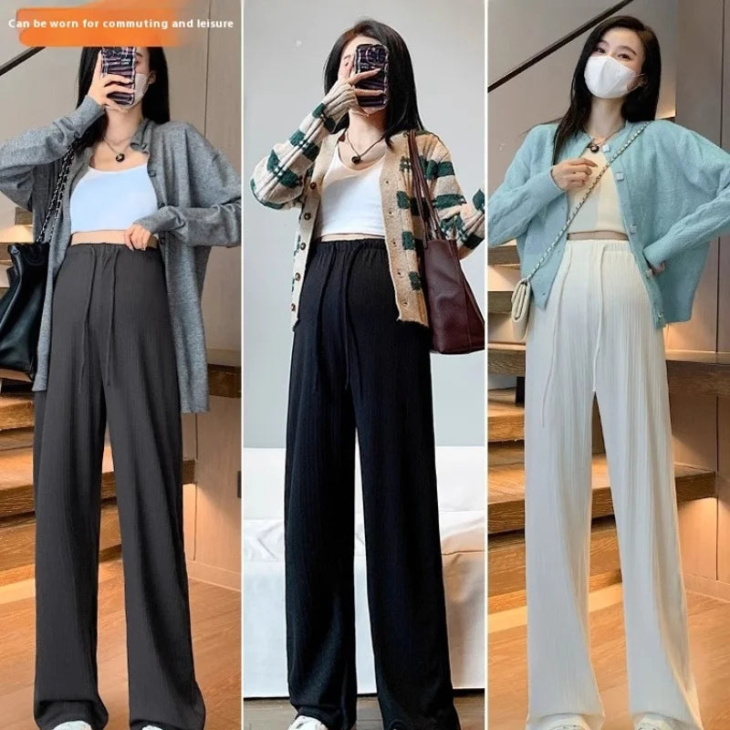 Wide-leg maternity pants showcased in three colors, perfect for commuting and leisure, featuring a drawstring belly-free design.