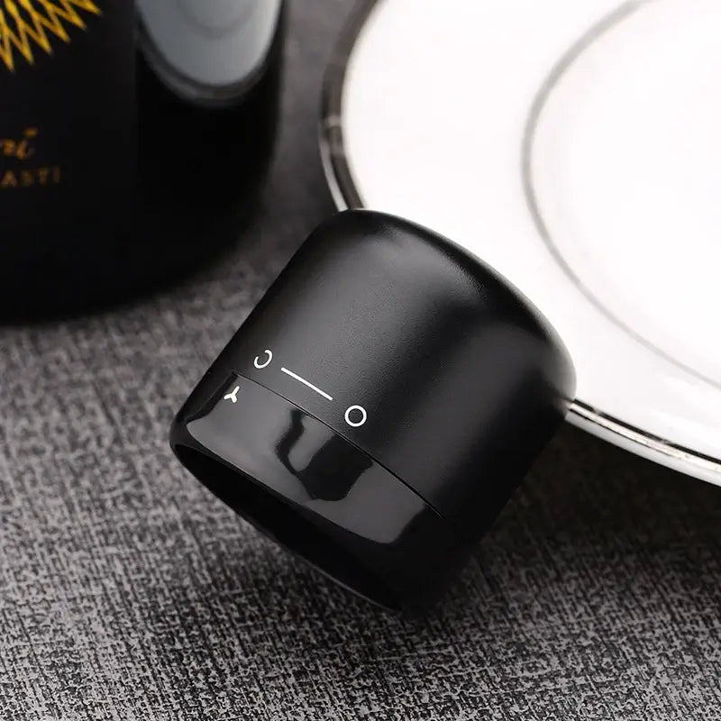 Vacuum Red Wine Bottle Cap Stopper in black silicone, designed for airtight sealing and preserving wine freshness.