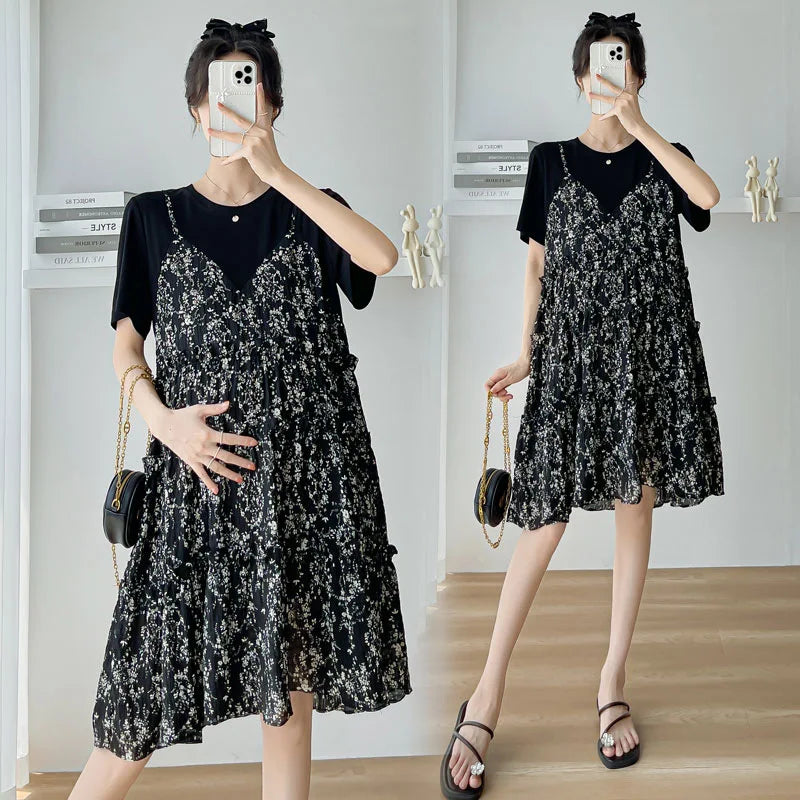 Elegant black floral maternity dress with layered ruffles, perfect for summer baby showers.