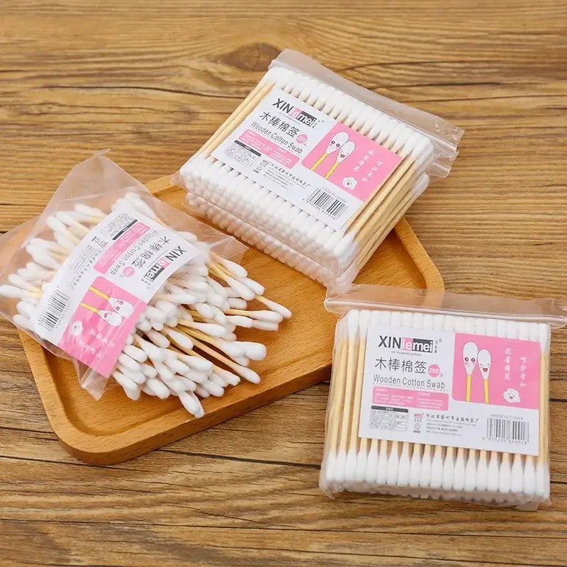 100pcs Baby Cotton Swabs in bags, wooden stick, soft cotton tips, ideal for infants and kids personal care.