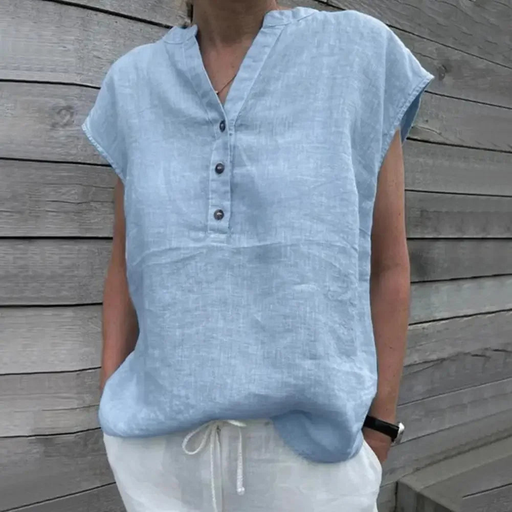 BreezyLuxe™ light blue cotton linen V-neck blouse with buttons, perfect for summer wear.