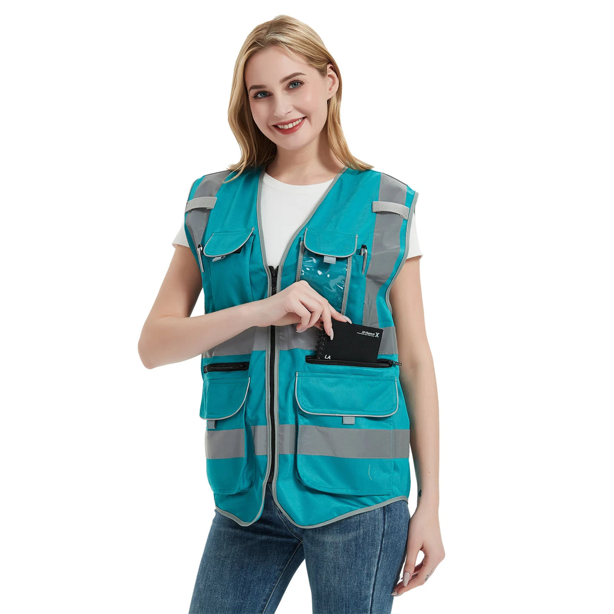 Smiling woman wearing a turquoise safety vest with reflective tape, showcasing a multipocket design for work and outdoor activities.