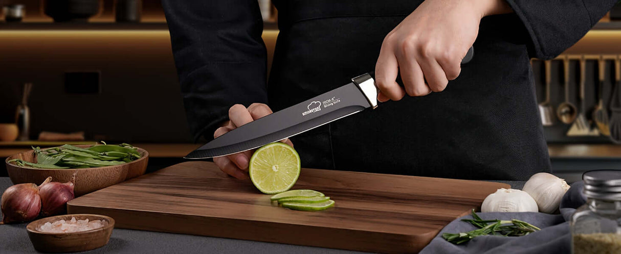 Person cutting a lime with Amorston premium kitchen knife on wooden cutting board in modern kitchen setting.