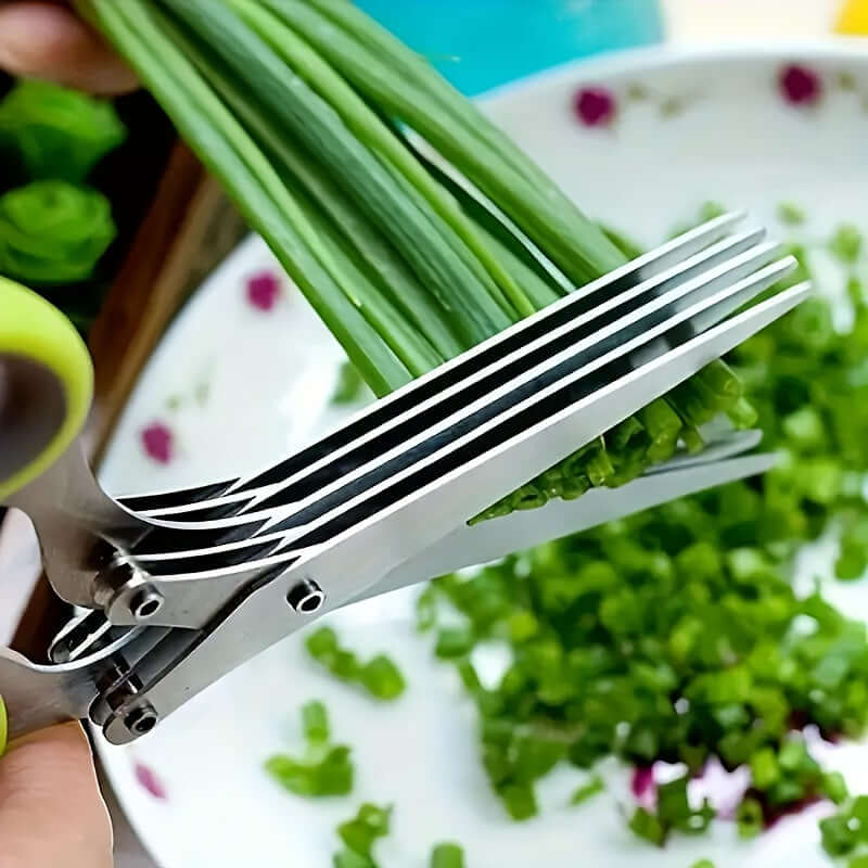 Durable stainless steel kitchen scissors cutting green onions for food preparation, ambidextrous design.