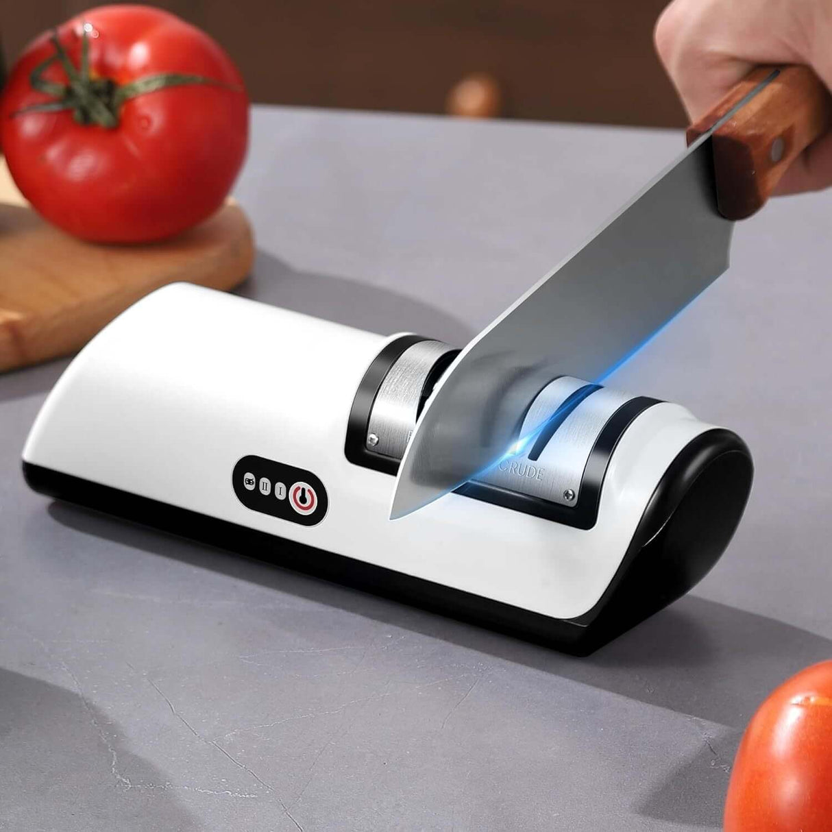 2-stage electric knife sharpener in use, showcasing USB rechargeable design, sharpens knife while cutting fresh tomatoes.