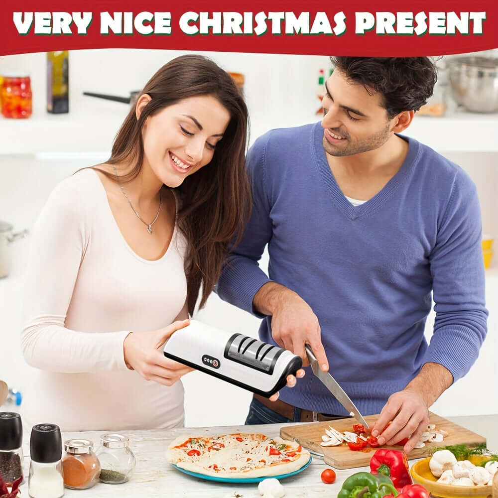 Couple using a 2-stage electric knife sharpener in a kitchen, highlighting its ease of use as a thoughtful Christmas gift.