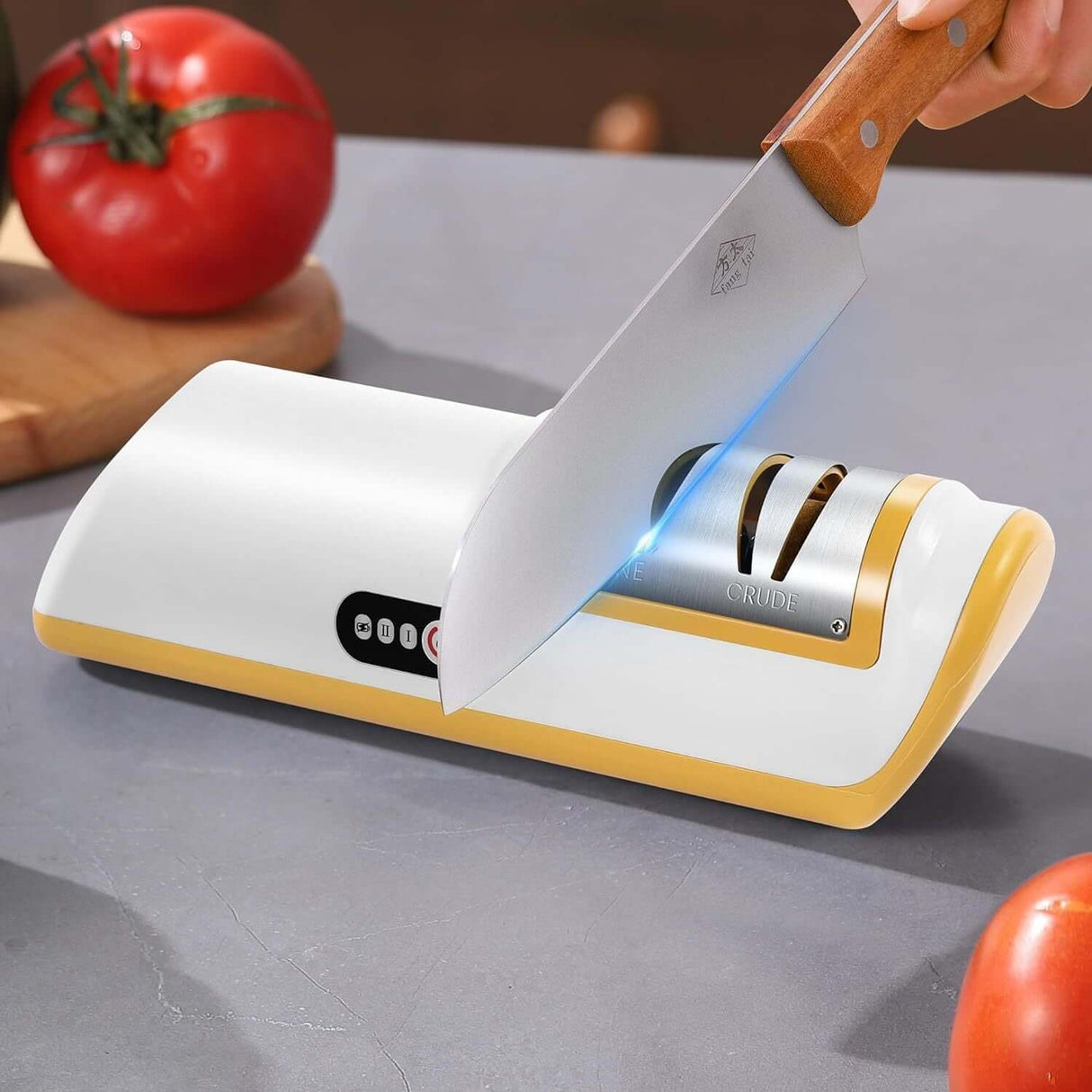 2-stage electric knife sharpener in action with knife sharpening against a backdrop of fresh tomatoes.