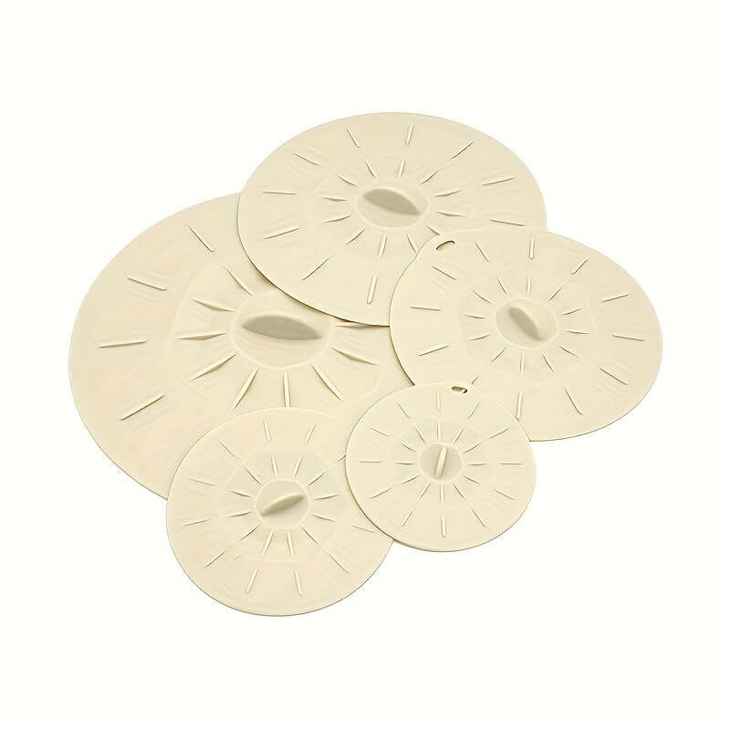 Set of 5 heat-resistant silicone bowl lids in various sizes, ideal for food storage, made from durable material.