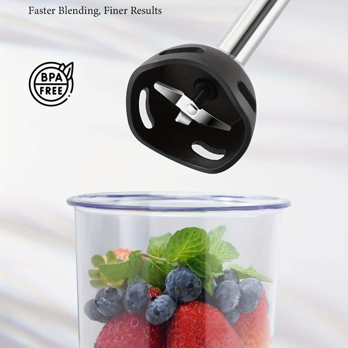 GDOR 6-In-1 immersion blender close-up, blending fresh berries and mint, BPA-free for healthier results.