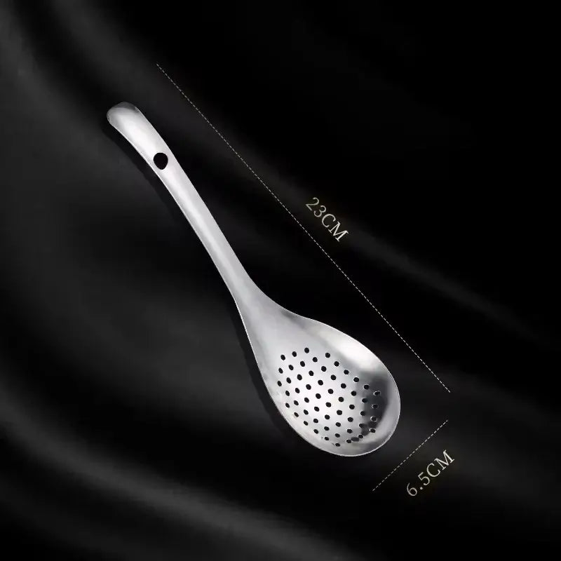 Stainless steel strainer spoon with measurements 23CM by 6.5CM, ideal kitchen colander tool for cooking and food preparation.