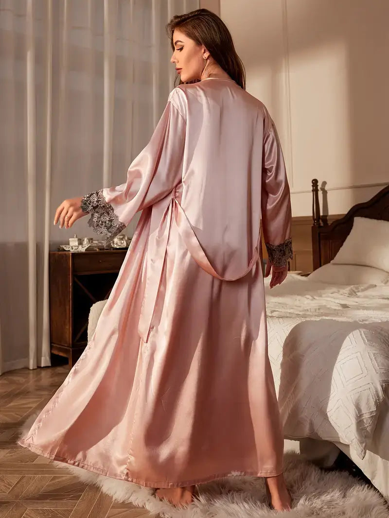 Elegant women's satin sleepwear robe in soft pink, showcasing a luxurious design for comfortable nights.