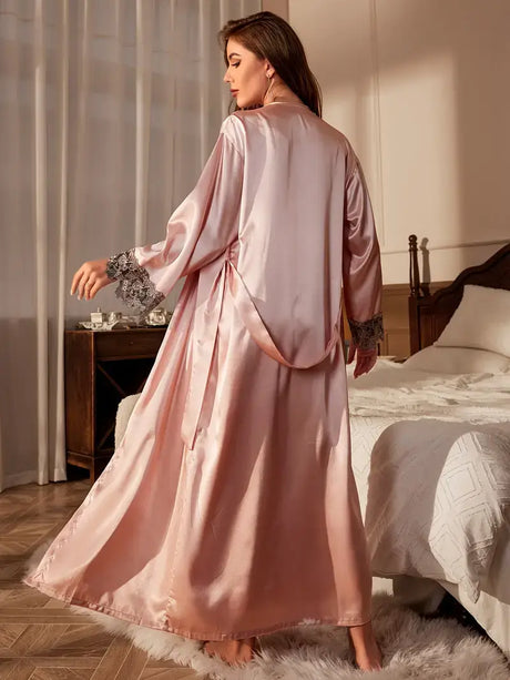 Elegant women's satin sleepwear robe in soft pink, showcasing a luxurious design for comfortable nights.