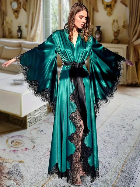 Elegant women's sexy lingerie robe in teal satin with lace trim, styled in an opulent interior.