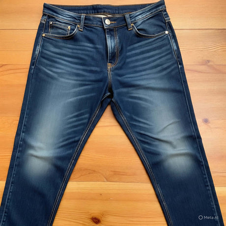 Men's plus size jeans in a dark blue wash, featuring a classic five-pocket design and faded details.