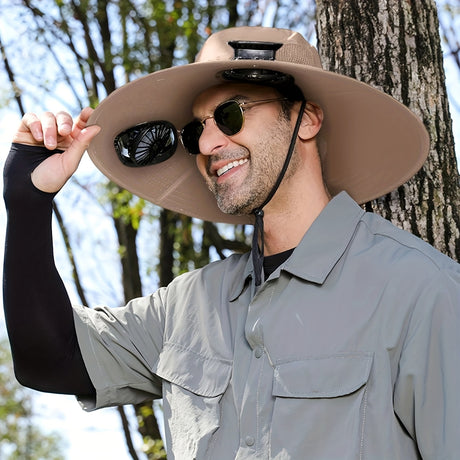 Man wearing a solar dual fan anti-UV hat outdoors, showcasing comfort and sun protection features.