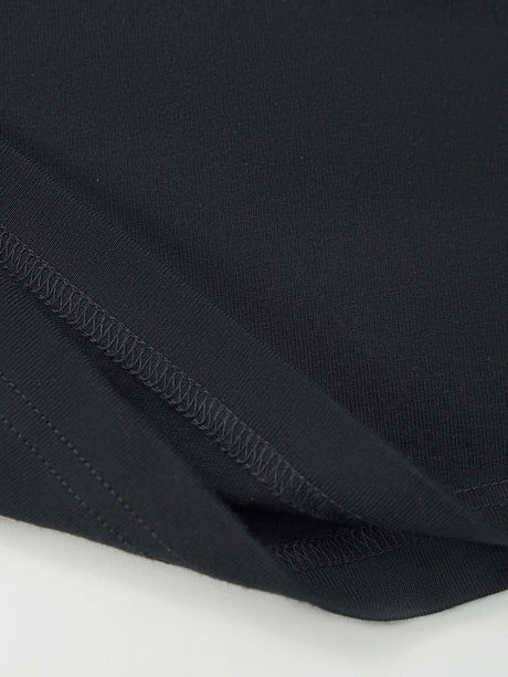 Close-up of the fabric and stitching on a Women's Cowgirl Graphic T-Shirt in black, made from 100% cotton.