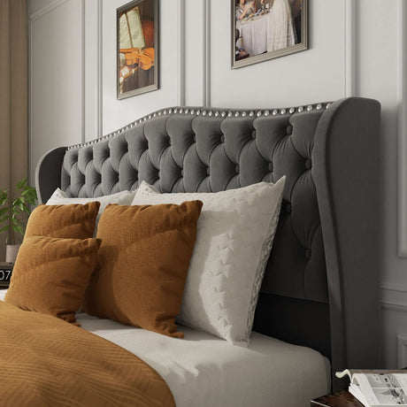 Contemporary bed frame with elegant tufted grey headboard and decorative pillows in a stylish bedroom setting.