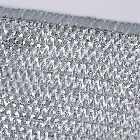 Close-up of a silver non-stick oil iron dishwashing cloth, showcasing its textured surface and knit fabric design.