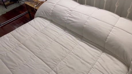 Queen Cooling Comforter on a bed, featuring a medium weight, 100% cotton cover and ultrasonic embossing design.