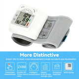 Automatic wrist blood pressure monitor displaying measurements with user-friendly interface and intelligent features.
