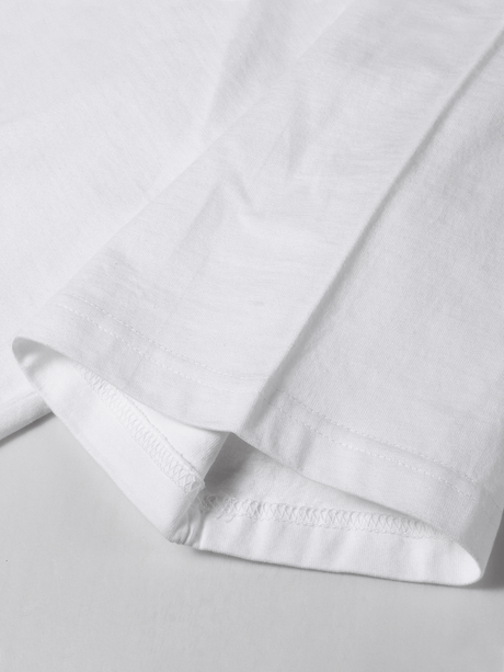 Close-up of the short sleeves and fabric detail of a white women's cotton t-shirt, showcasing knit texture and micro elasticity.