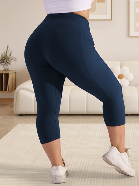 Plus-size model wearing navy 3pcs stretch polyester leggings with side pockets and high stretch for comfort.