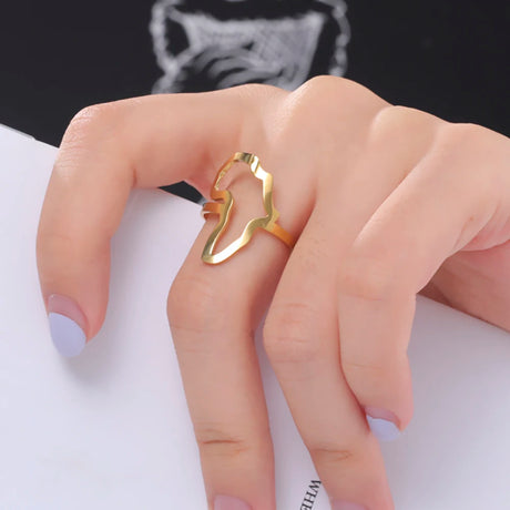 Stylish African map gold ring worn on a woman's finger, perfect for daily wear and gift giving.