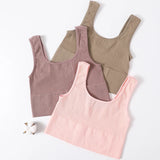 RibSculpt™ seamless ribbed camisoles in pink, brown, and tan on a white background.