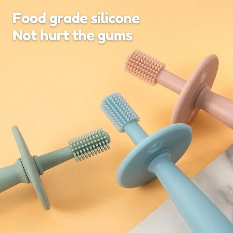 Baby soft silicone training toothbrushes in pastel colors, designed for gentle gum care, perfect for infants and toddlers.