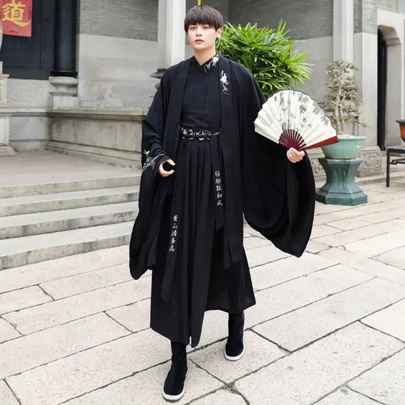 Han Dynasty couple costume featuring a swordsman outfit in black, made of cotton and polyester, shown with a traditional fan.