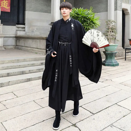 Han Dynasty couple costume featuring a swordsman outfit in black, made of cotton and polyester, shown with a traditional fan.