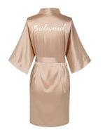 Rose gold satin bridesmaid robe featuring elegant back design and short sleeves, perfect for bridal parties.