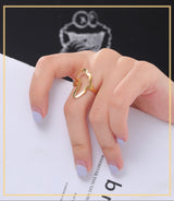 Gold African map ring on a woman's finger, showcasing stylish women's jewelry for daily wear.
