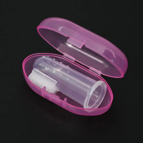Pink protective case with silicone baby toothbrush and cleaning brush inside, ideal for infants and toddlers.