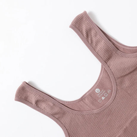 RibSculpt™ seamless ribbed camisole in dusty pink, featuring a classic O-neck and wireless design.