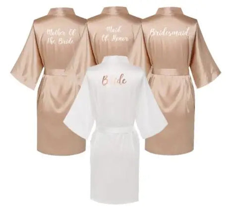Rose gold and white satin robes for brides, bridesmaids, and mother of the bride with elegant text designs.