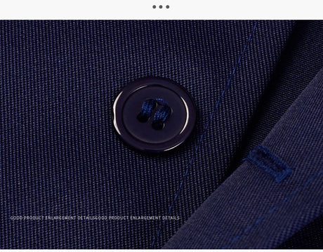 Close-up of a navy fabric with a large button, showcasing the quality and detail of the Workshop Coverall.