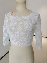 Crystal Beaded Wedding Jacket 3/4 Sleeve Bolero features intricate appliqued floral design and sheer fabric for bridal elegance.