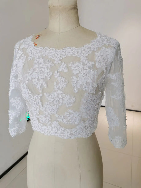 Crystal Beaded Wedding Jacket 3/4 Sleeve Bolero features intricate appliqued floral design and sheer fabric for bridal elegance.
