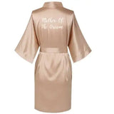 Rose gold satin robe with 'Mother Of The Groom' text, perfect for weddings and bridal parties.