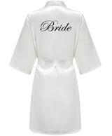 Team Bride satin robe in white with stylish 'Bride' lettering on the back, ideal for wedding celebrations.