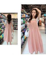 Korean loose fit maternity dress in pink, ideal for holiday photography, showcasing a stylish casual look