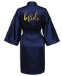 Navy satin kimono robe with 'bride' in gold lettering, perfect for bridal parties and wedding preparations.