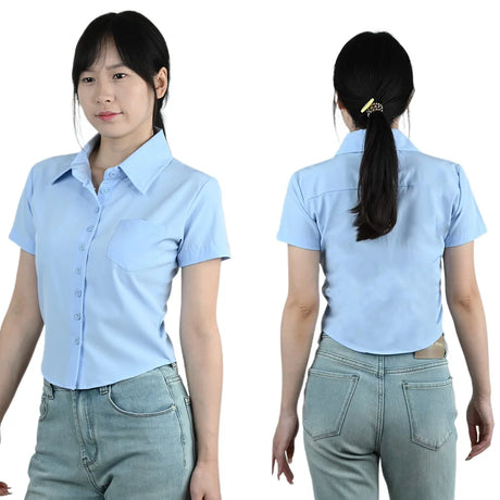 Woman wearing a short sleeve light blue slim fit business blouse with a turn-down collar and front pocket.